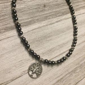 Hematite 6MM Bead Necklace with Onyx and Silk Hand